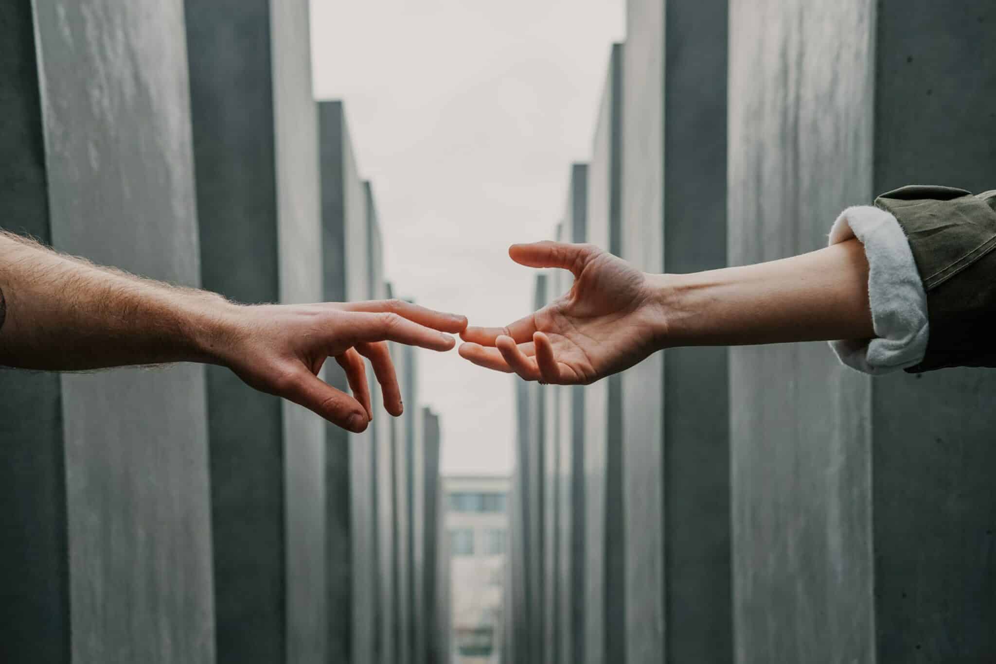 an image of people holding hands have learning how to help an alcoholic