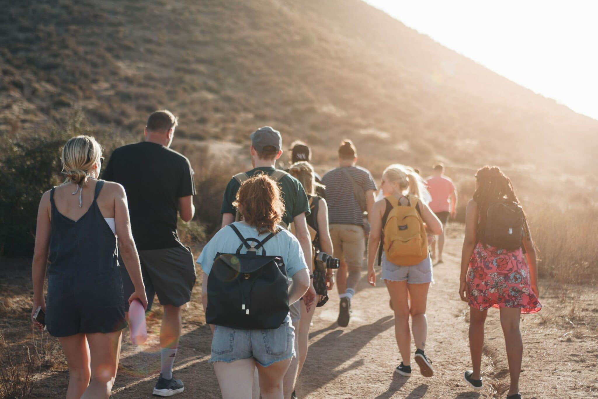 An image of friends on a hike engaging in relapse prevention