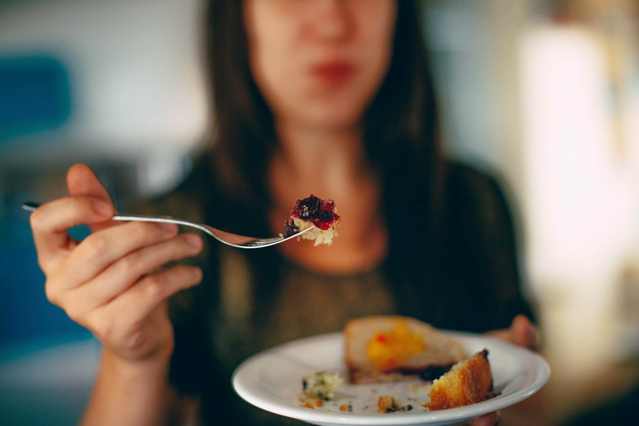 an image of a person eating who overcame an eating disorder and addiction