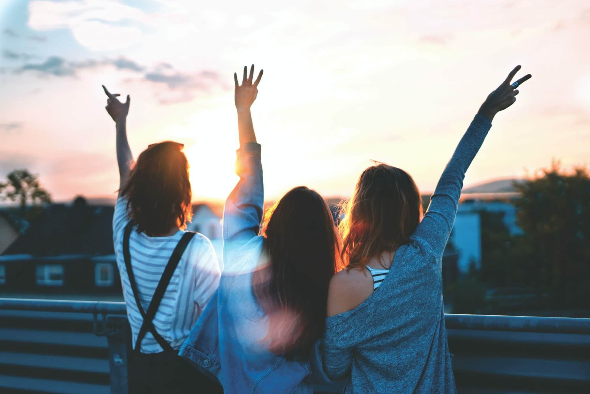 an image of friends looking at the sky