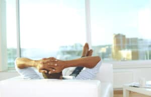 person relaxing on the couch overlooking the city