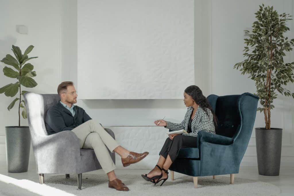 An image of a counselor and a patient in a long-term rehab