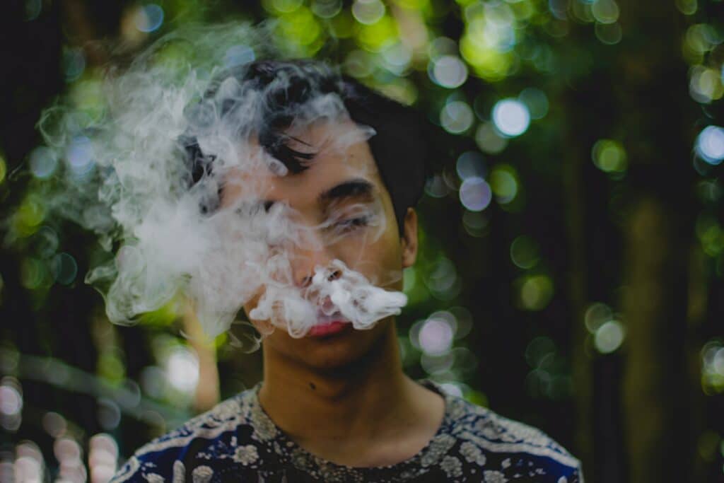 An image of a man smoking a cigarette | Things to know about addiction