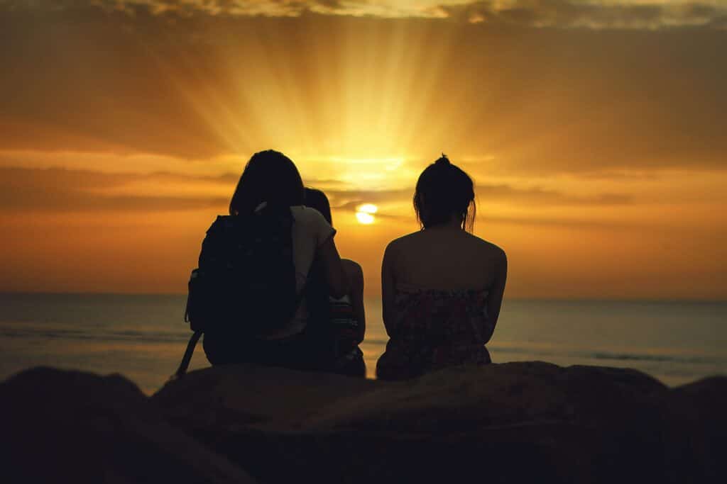 An image of people by the beach enjoying a Non-Alcoholic Drink