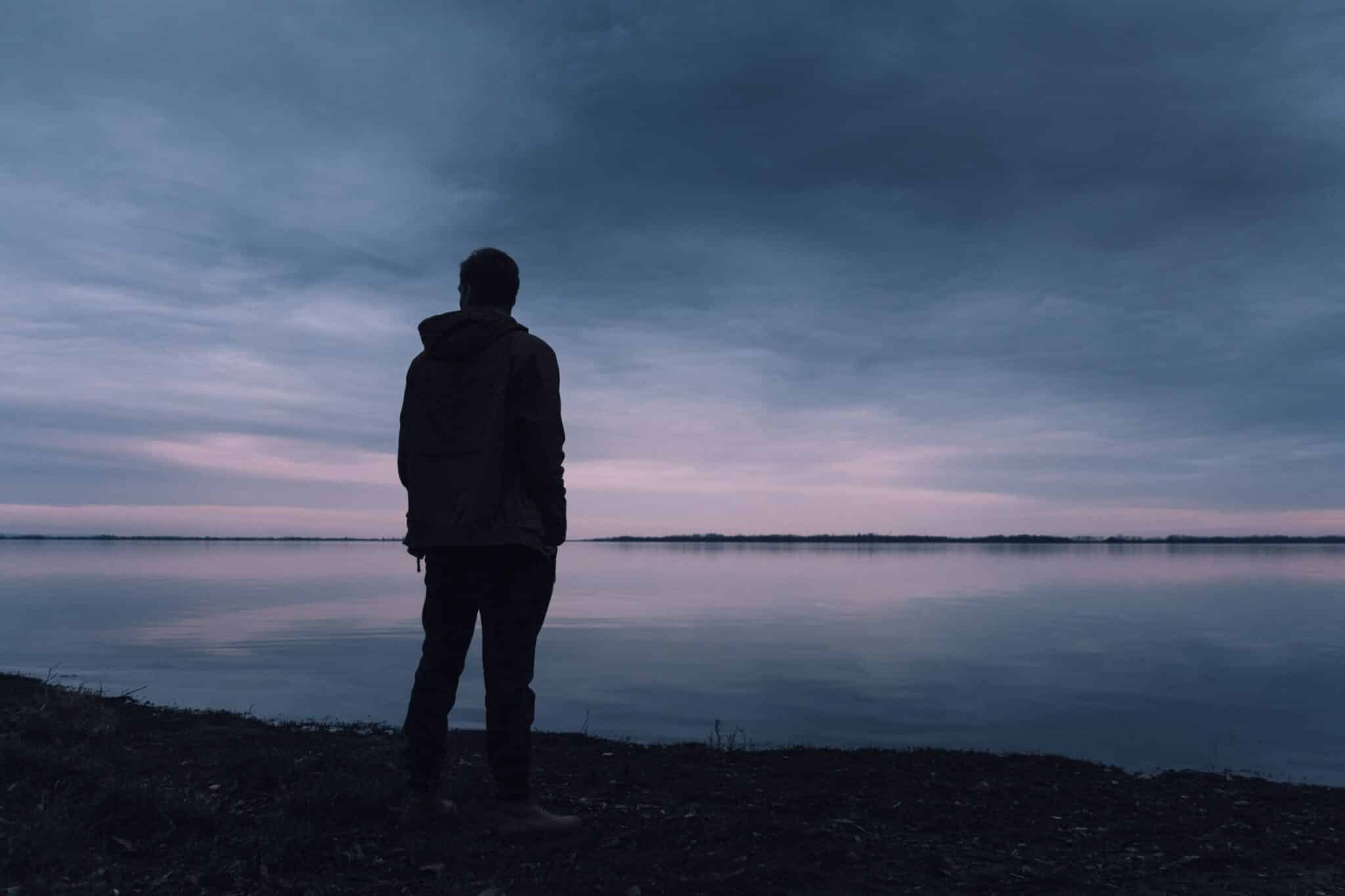 An image of a man on a lake who struggles with Demerol addiction