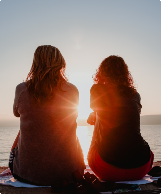 2 people looking out into the ocean