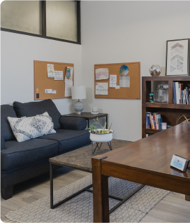 Office room with a couch in it