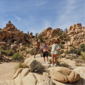 3 people taking a photo together on a hike