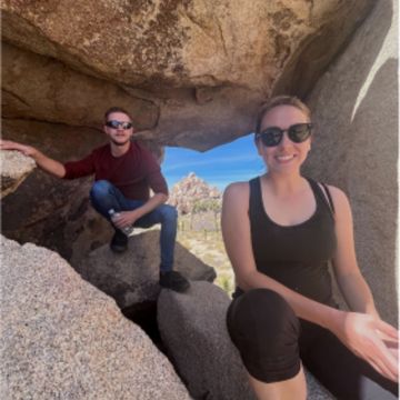 2 people hanging out on a hike together