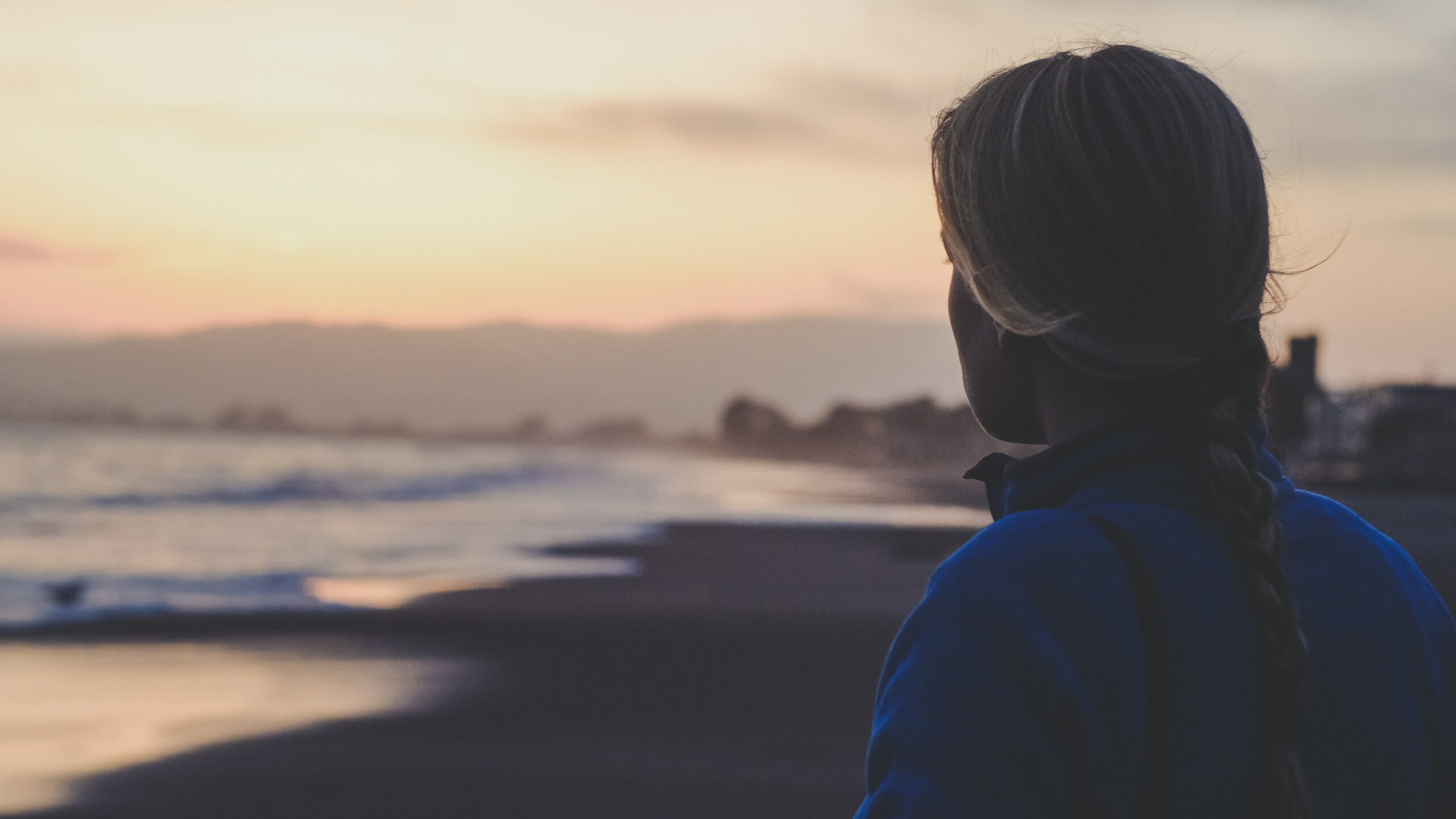 an image of a women near the beach wondering about prescription drug addiction..