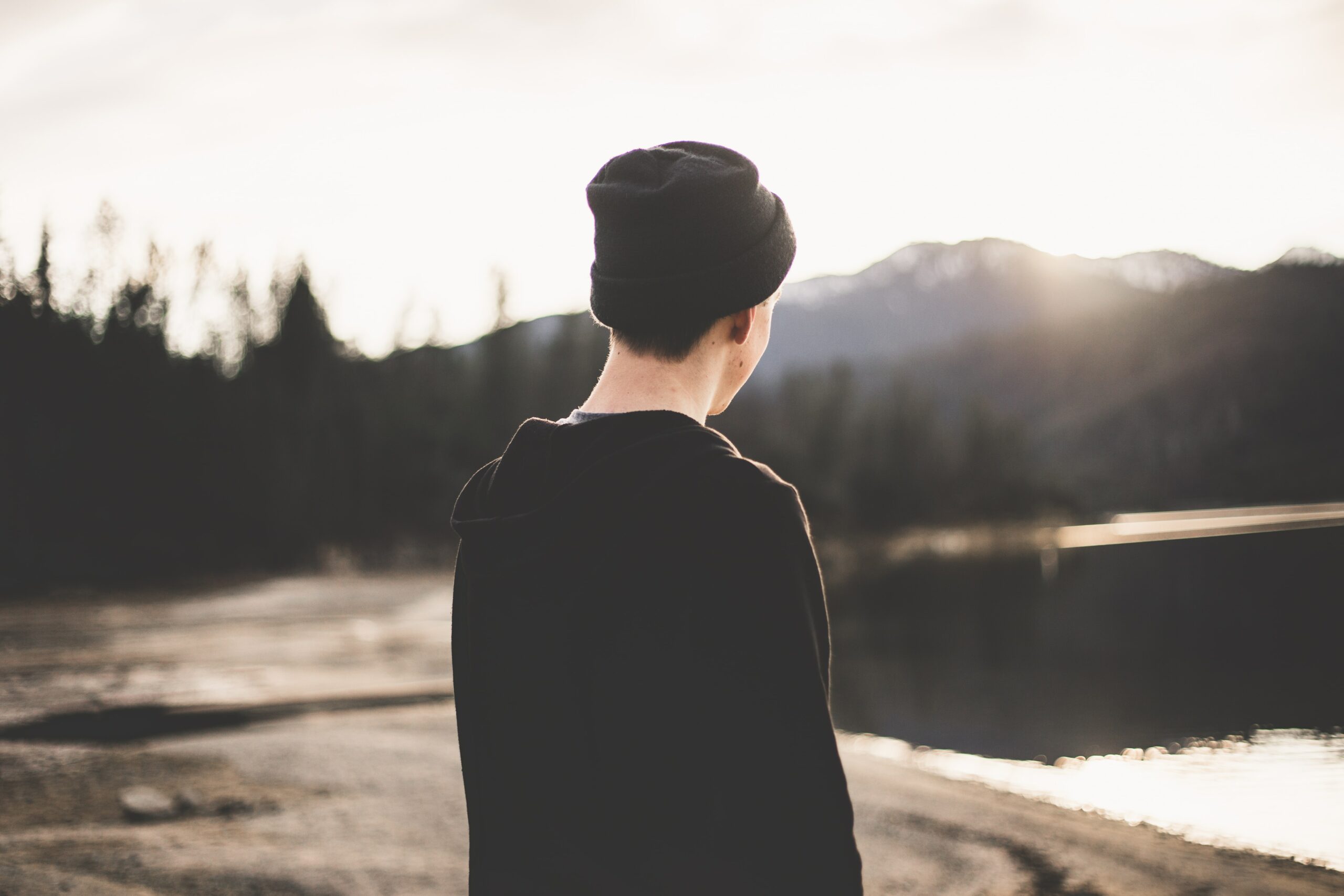 an image of a man looking out a a body of water to represent cocaethelyne: mixing cocaine and alcohol