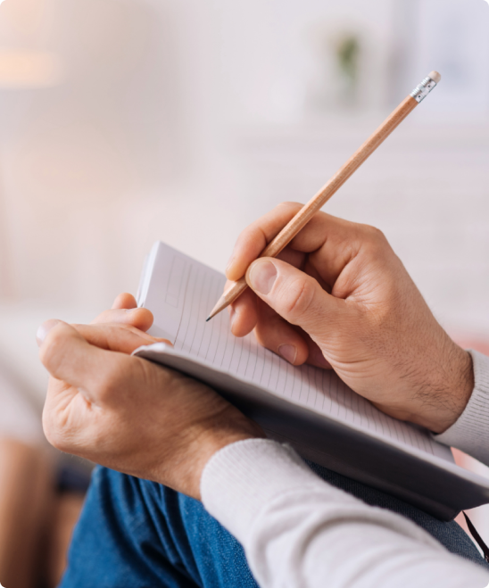 doctor is writing in a booklet prescribing wellbutrin and warning about the side effects of mixing wellbutrin and alcohol.