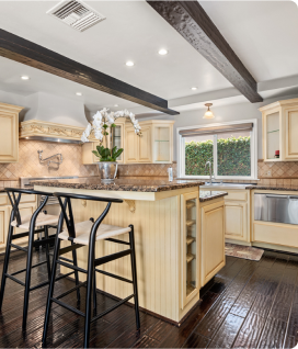 inside of a house that shows off the kitchen