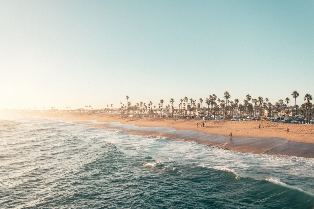 an image of a beach during sunset at newport beach