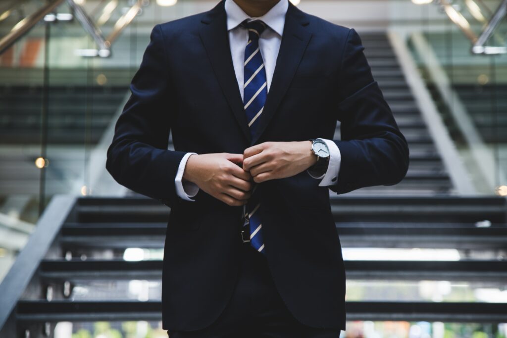 an image of a man getting ready in his suit