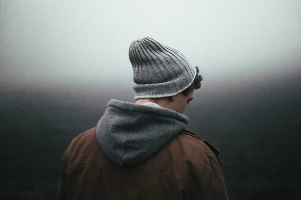 a man standing dealing with the long-term effects of alcohol use