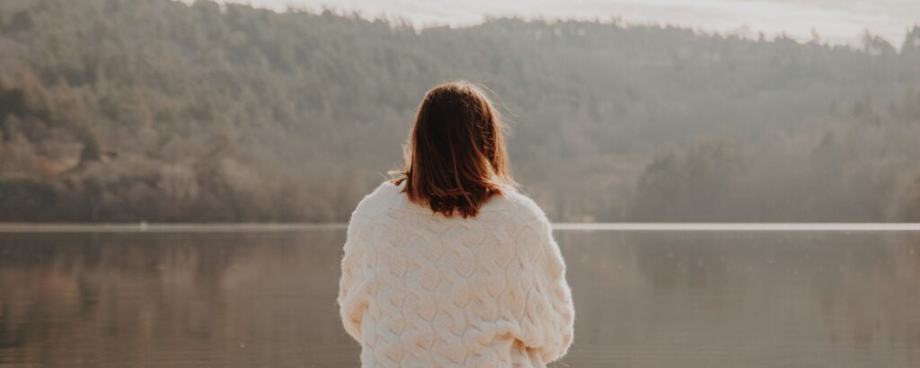 woman looking out at lake representing lexapro withdrawal