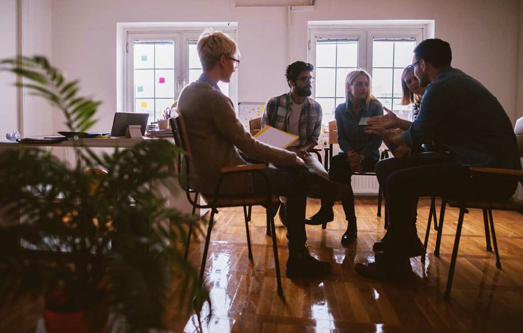 image of a group of people representing addiction therapy groups