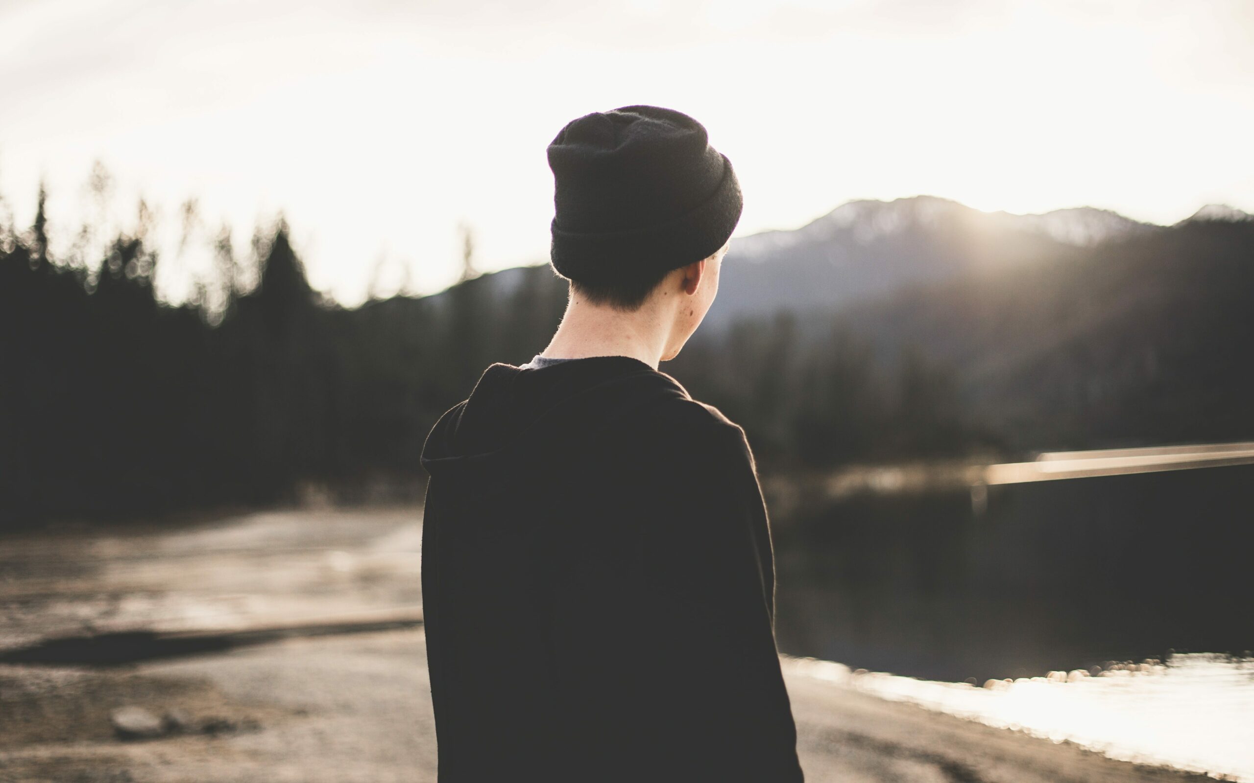 an image of a man looking out a a body of water to represent cocaethelyne: mixing cocaine and alcohol 