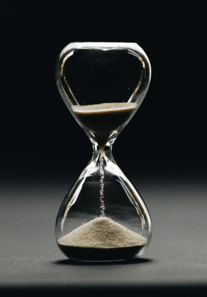 hourglass having sand go through it