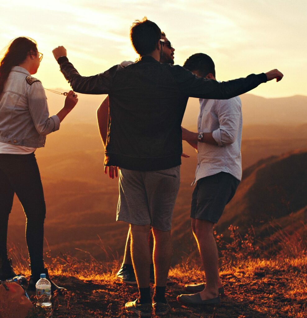 a group of people are celebrating at sunset to represent heroin rehab southern california.