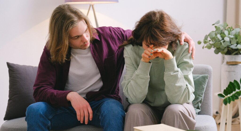 photo of two people representing living with an addict