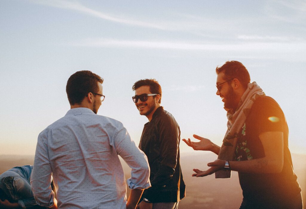 3 men talking to one another representing what is sobriety