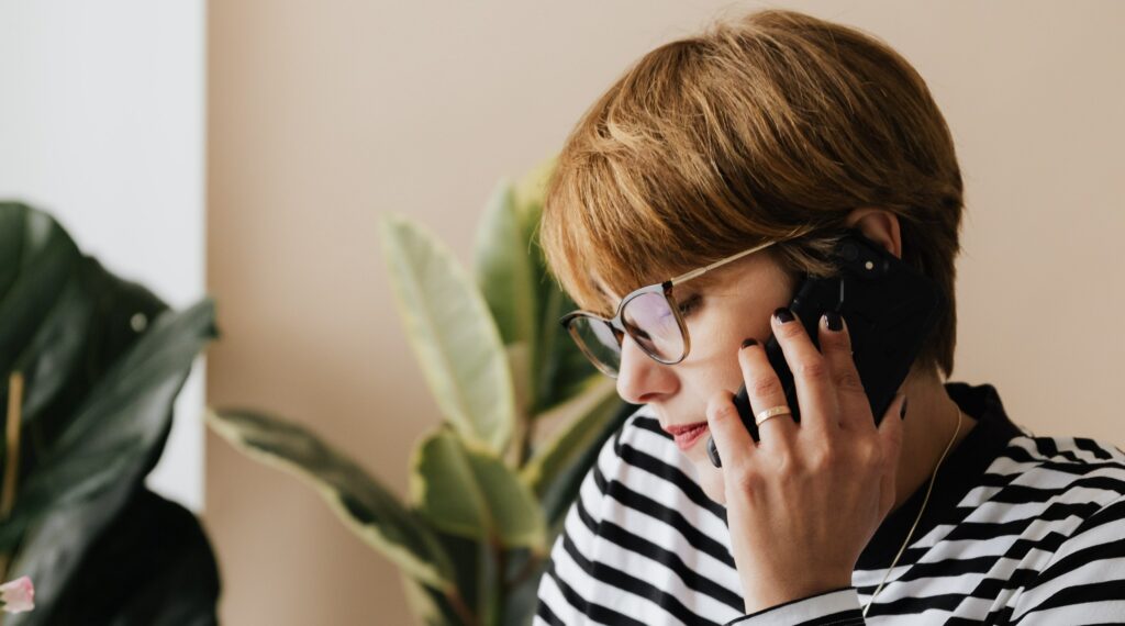 Woman calling a drug addiction hotline.