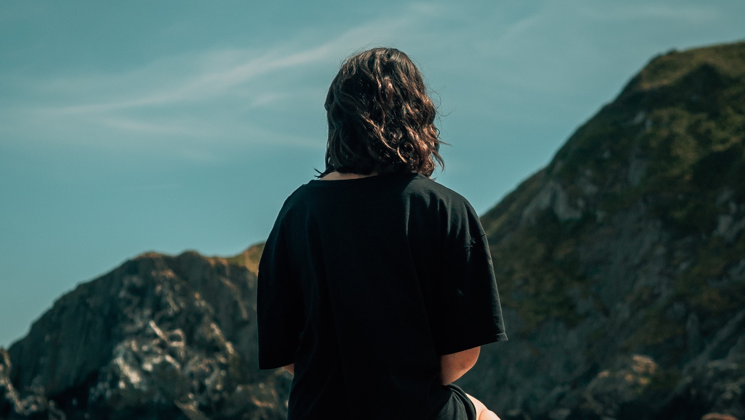 a woman sits near the beach representing the question is prozac addictive