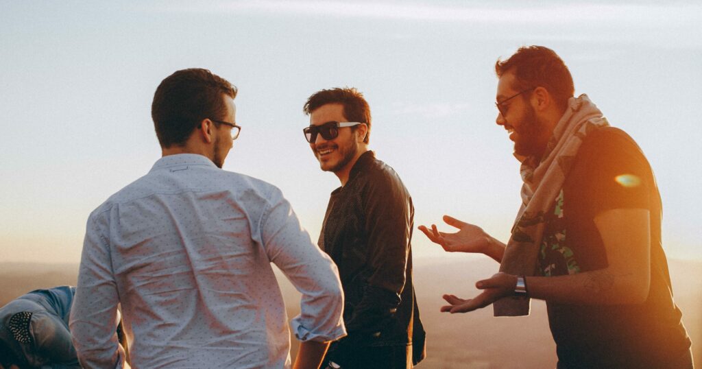 3 men talking to one another representing what is sobriety