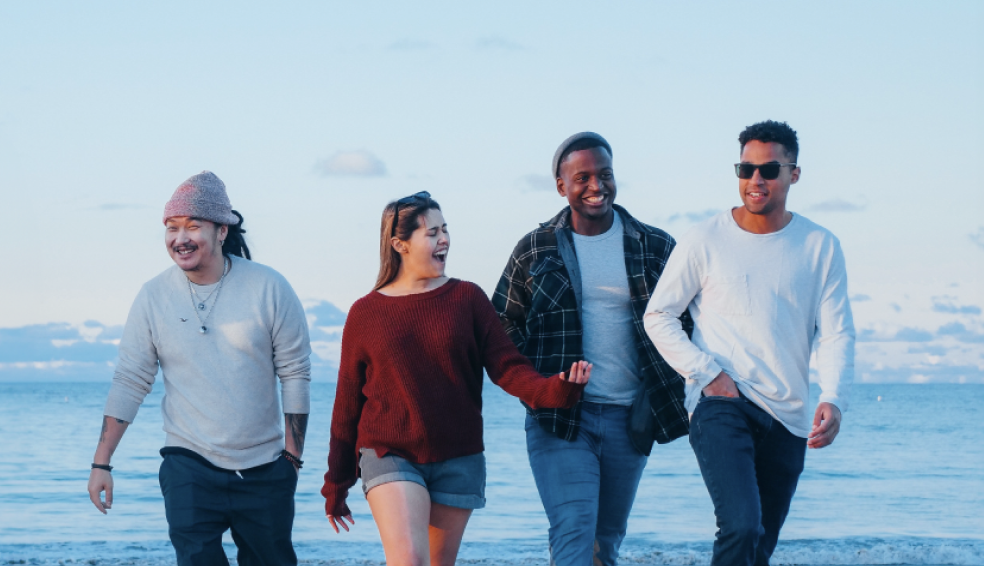 group of people laughing to represent yoga therapy for addiction