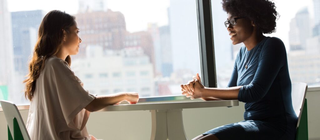 two people meeting to represent ip 109 white oval pill