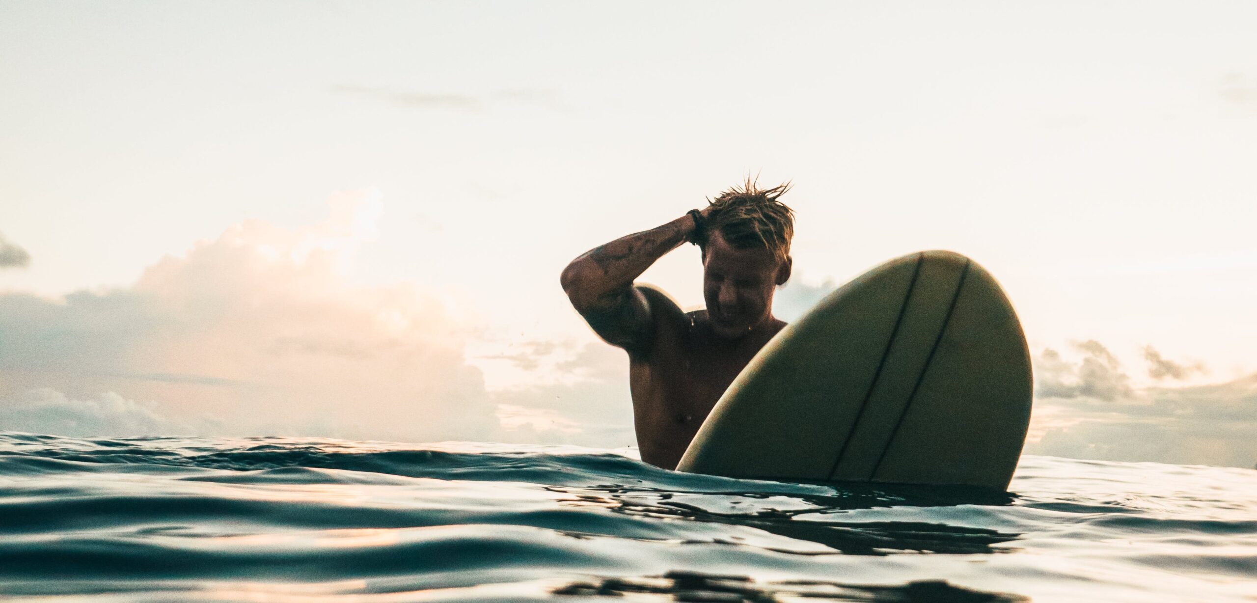 surfer on a surf board hanging out in the water