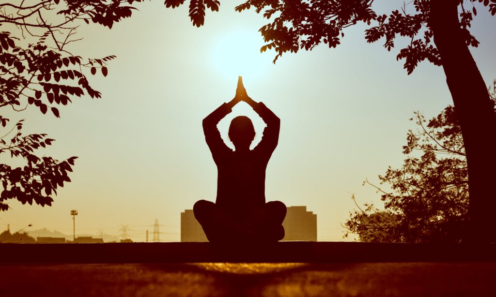 An image of someone doing yoga representing international mind and body wellness day activities