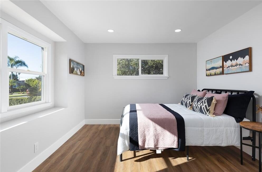 Bedroom with the bed facing an open window