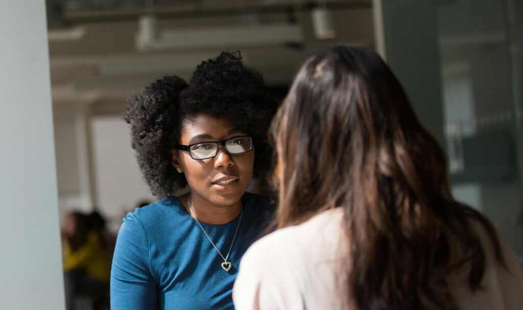 image of two women discussing common side effects of oxycodone 